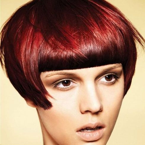 Red color pixie cut with bangs for long faces