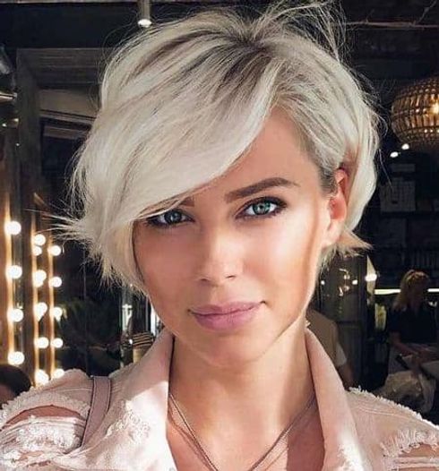 Side swept pixie hair with long bangs