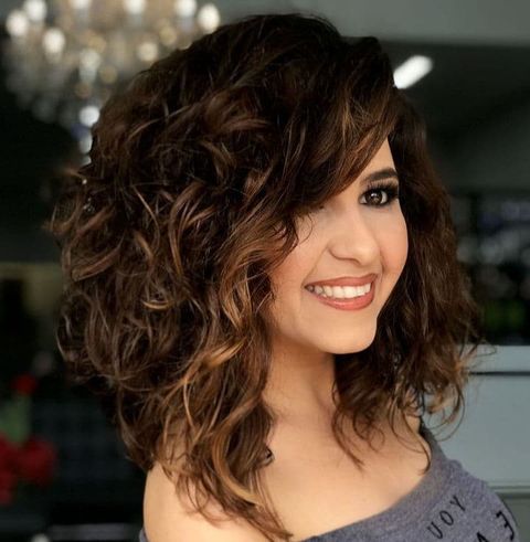 Asymmetrical mid-length curly hair for women 2021-2022