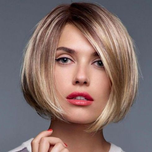 Center parted short haircut with blonde balayage
