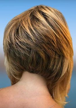 Asymmetrical layered long bob haircut brown color